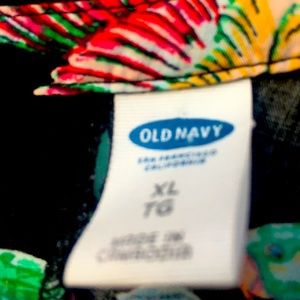 Black cotton floral dress with macaws and bright flowers.